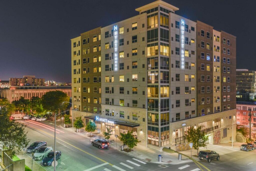 The outside picture of the Hyatt House in Austin shows that this is where to stay in Austin: its close location encourages guests to go downtown . 